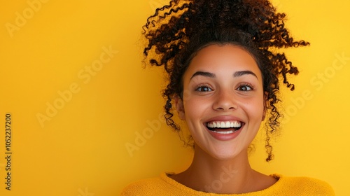 A young woman with an excited expression, eyes wide and mouth open, photo