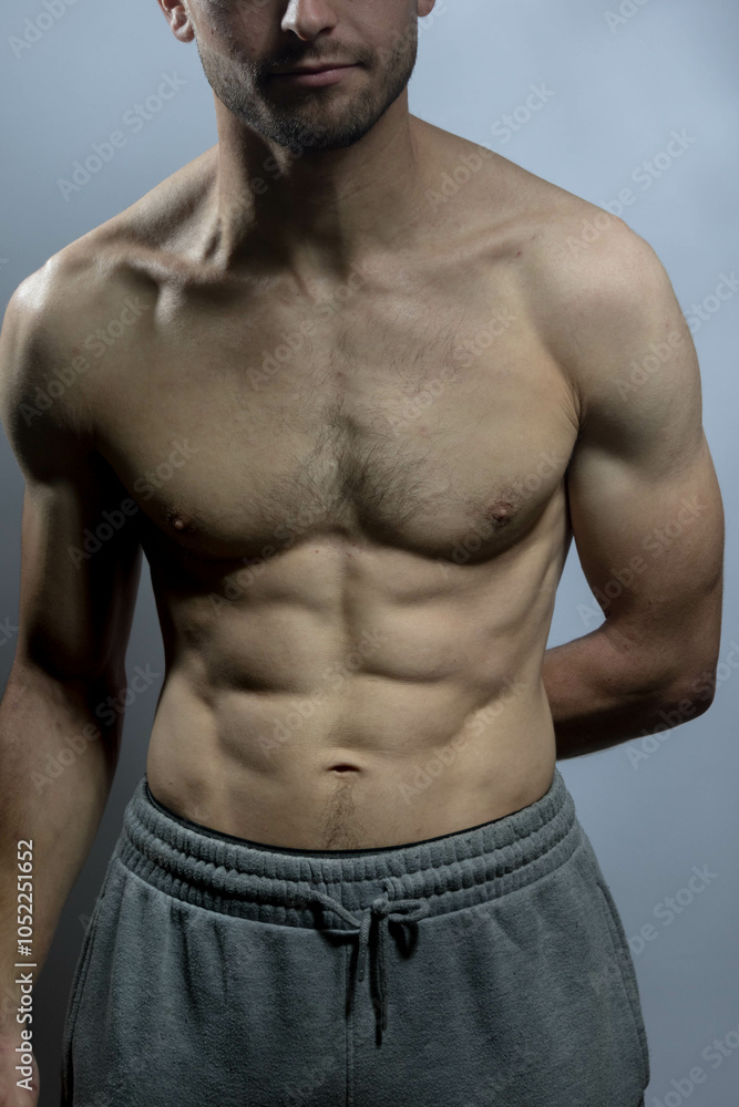 Obraz premium A young shirtless muscluar man
