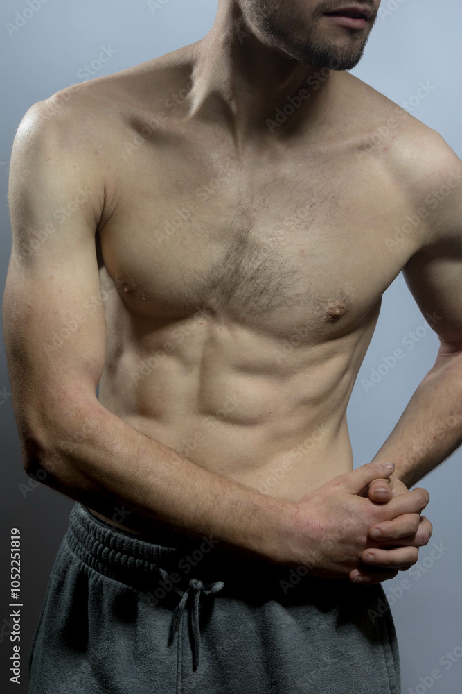 Fototapeta premium A young shirtless muscluar man