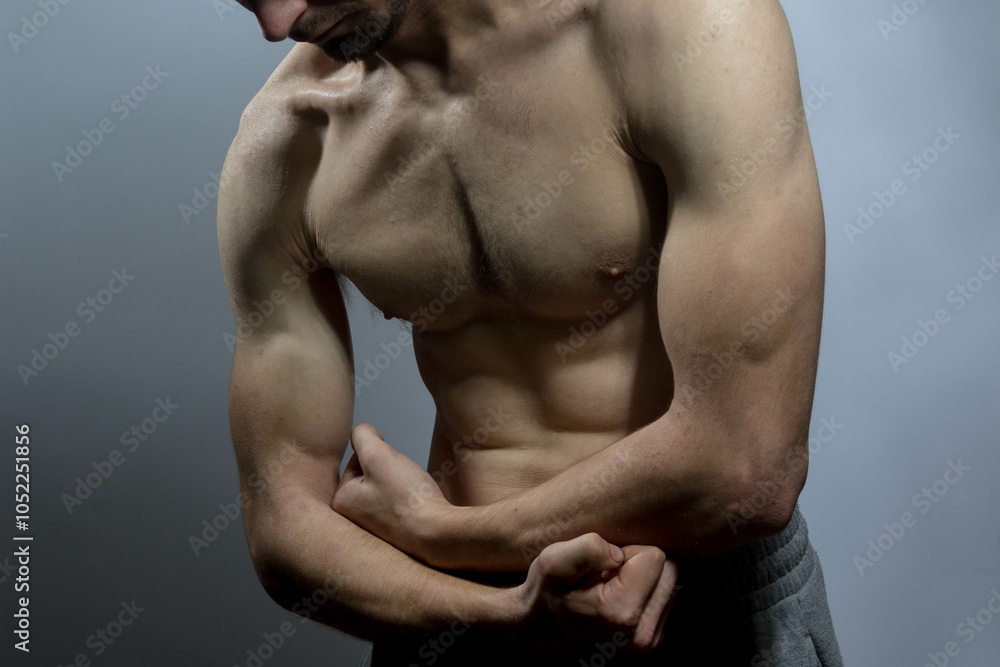 Fototapeta premium A young shirtless muscluar man