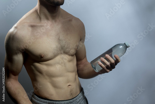 A young shirtless muscluar man photo