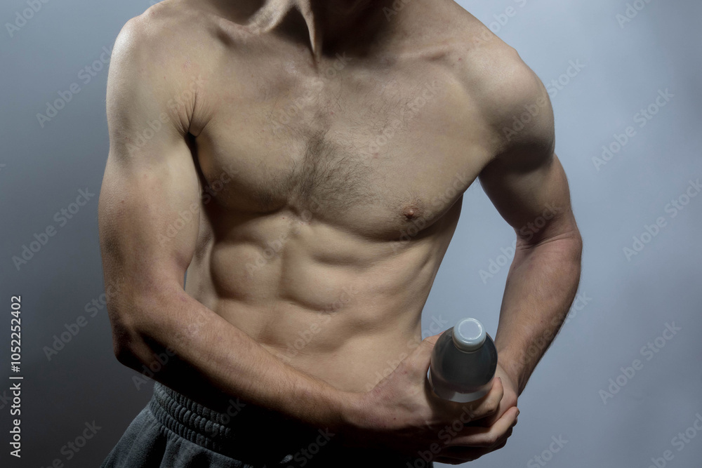 Naklejka premium A young shirtless muscluar man
