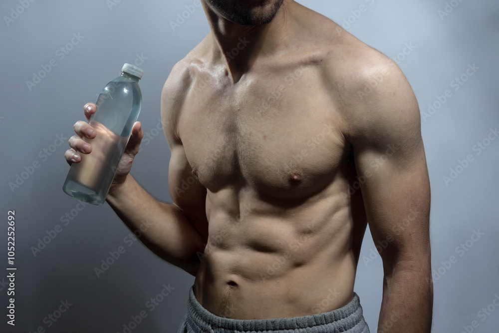 A young shirtless muscluar man A young shirtless muscluar man