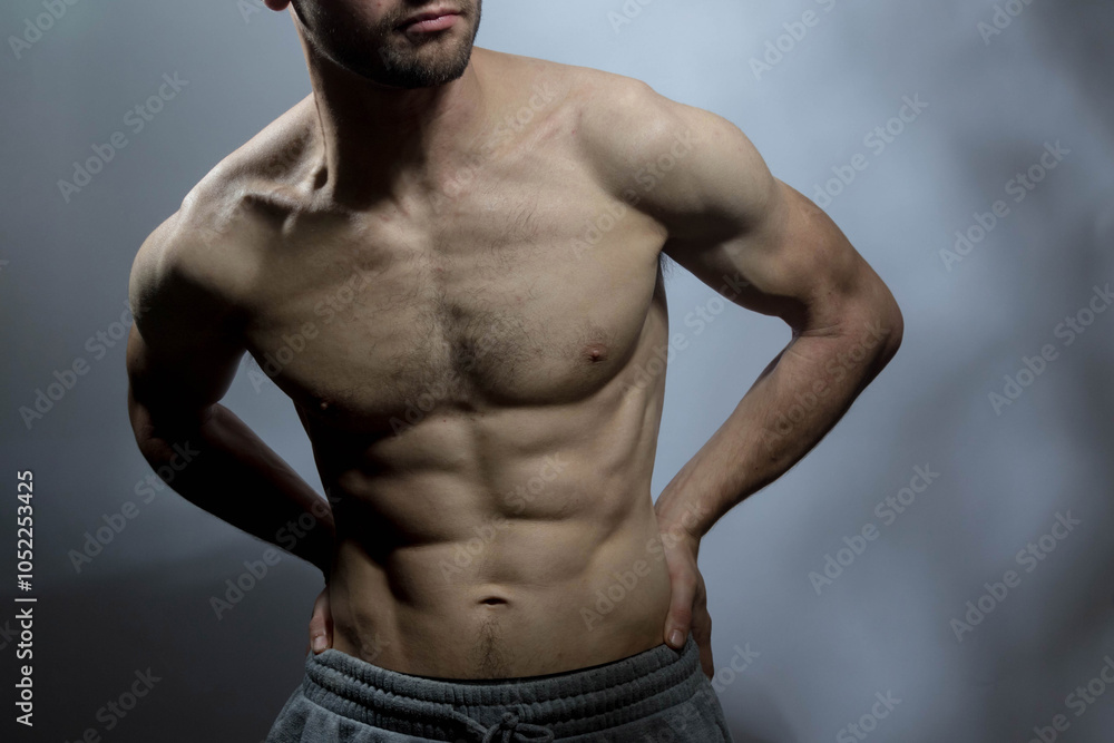 Fototapeta premium A young shirtless muscluar man