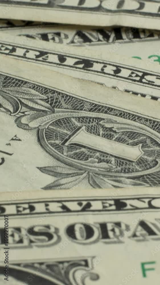 The photograph displays a close-up of a one-dollar bill, highlighting the various design elements, symbols, and the face of George Washington. Details of the currency are vividly captured. The photograph displays a close-up of a one-dollar bill, highlighting the various design elements, symbols, and the face of George Washington. Details of the currency are vividly captured.