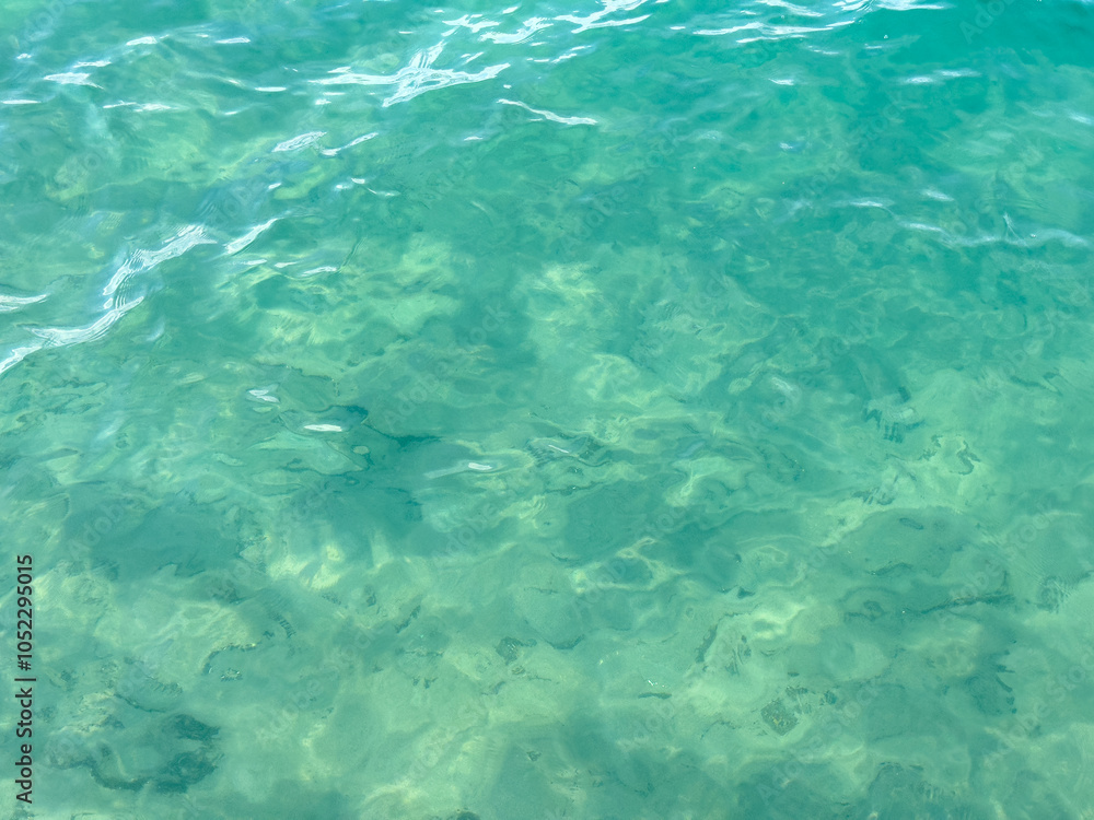 Texture of blue calm water creates a serene and peaceful background. The natural beauty of water reflects the essence of nature, evoking a sense of tranquility reminiscent of the sea. Texture of blue calm water creates a serene and peaceful background. The natural beauty of water reflects the essence of nature, evoking a sense of tranquility reminiscent of the sea.