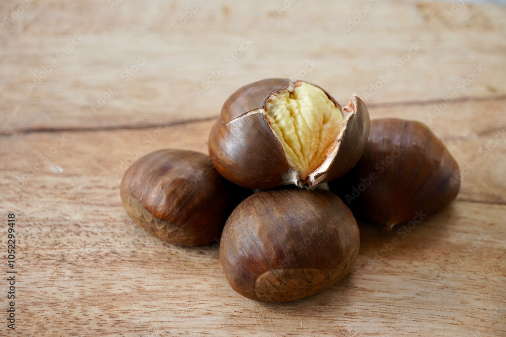 Chestnuts on the wooden table.
