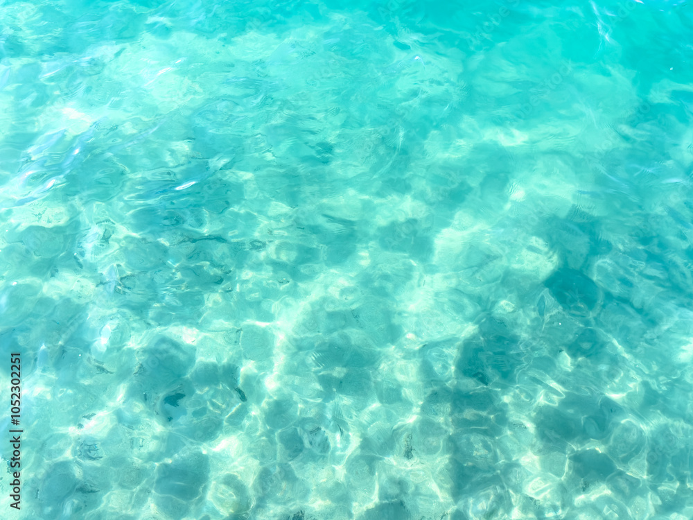 Texture of blue calm water creates a serene and peaceful background. The natural beauty of water reflects the essence of nature, evoking a sense of tranquility reminiscent of the sea. Texture of blue calm water creates a serene and peaceful background. The natural beauty of water reflects the essence of nature, evoking a sense of tranquility reminiscent of the sea.