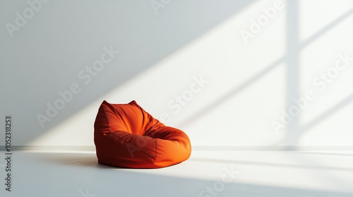 A solitary bean bag chair, vibrant in its orange hue, rests upon a pristine white backdrop.