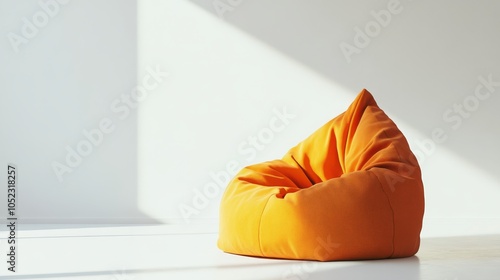 A solitary bean bag chair, vibrant in its orange hue, rests upon a pristine white backdrop.