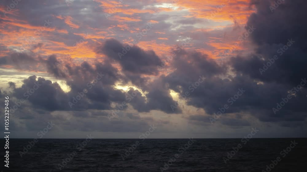 The ocean washes the beach with bright waves, creating an atmosphere of calm and relaxation at sunset. Travel, vacation and ralx concept. The ocean washes the beach with bright waves, creating an atmosphere of calm and relaxation at sunset. Travel, vacation and ralx concept.