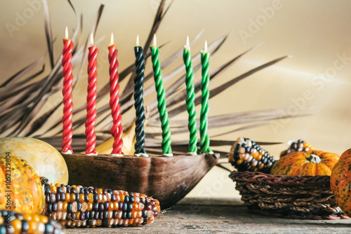 Kwanzaa, african holiday Kwanzaa with decoration of seven candles in red, black and green colors, vegetable harvest, corn. Greeting card banner. Happy Kwanzaa photo