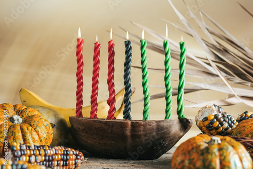 Kwanzaa, african holiday Kwanzaa with decoration of seven candles in red, black and green colors, vegetable harvest, corn. Greeting card banner. Happy Kwanzaa photo