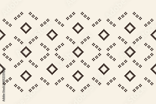 Fabric pattern traditional ethnic motifs ikat geometric cross stitch.Ikat embroidery Ethnic oriental Pixel brown cream label background. Abstract,vector,illustration. Texture,decoration,wallpaper. photo