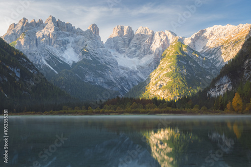 Calm, tranquil lake reflections of the Dolomite Mountains in Lago di Landro Dürrensee showcasing the serene beauty of South Tyrol, Italy. photo