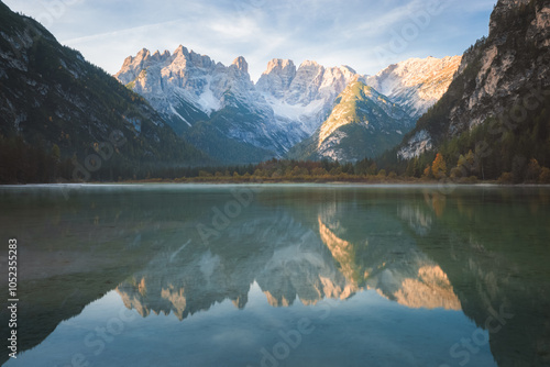 Calm, tranquil lake reflections of the Dolomite Mountains in Lago di Landro Dürrensee showcasing the serene beauty of South Tyrol, Italy. photo