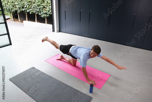 Man exercising in gym photo