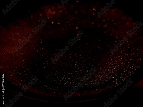 Not created by AI, abstract background with bubbles, red light on black gradient abstract background with circle light at the top center photo