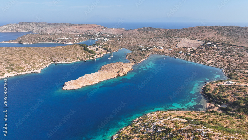 Aerial drone photo of yachts and sail boats anchored in tropical exotic island complex with crystal clear turquoise sea forming a blue lagoon Aerial drone photo of yachts and sail boats anchored in tropical exotic island complex with crystal clear turquoise sea forming a blue lagoon