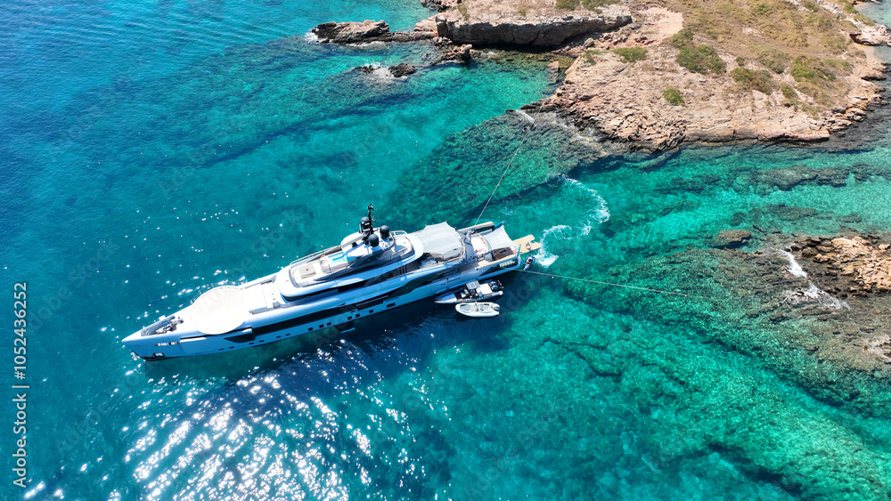Aerial drone photo of paradise blue lagoon and sandy beaches of Tiganakia bay forming a complex of small islets in island of Arkoi or Arki, Dodecanese, Greece Aerial drone photo of paradise blue lagoon and sandy beaches of Tiganakia bay forming a complex of small islets in island of Arkoi or Arki, Dodecanese, Greece
