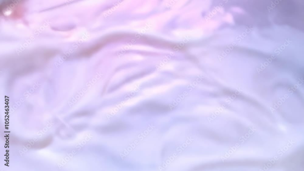 Close-up of iridescent liquid swirl with soft pastel colors Close-up of iridescent liquid swirl with soft pastel colors