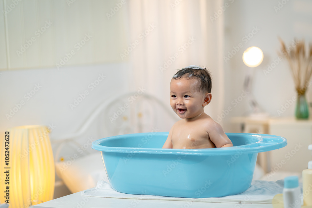Asian baby taking a bath at home Asian baby taking a bath at home