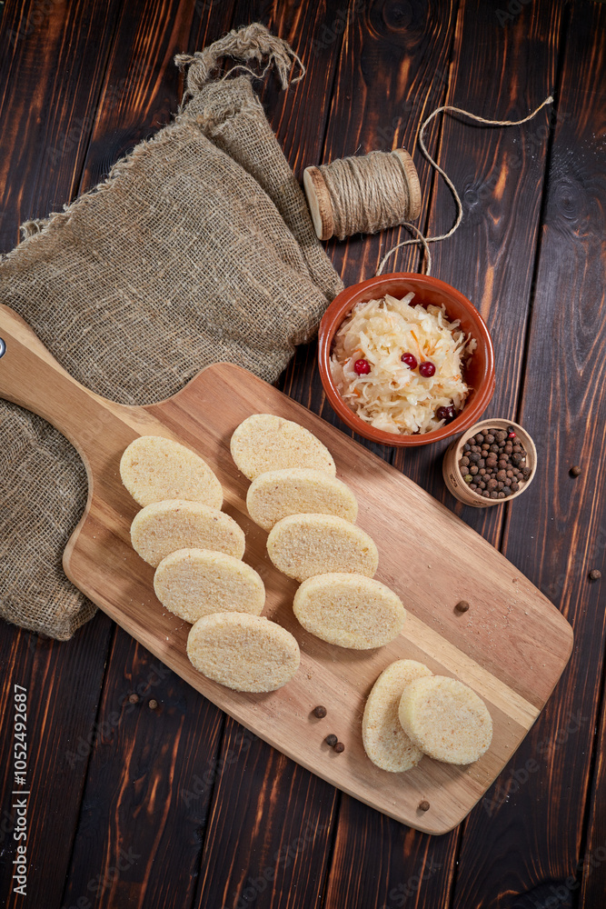 raw cutlets on the wooden board raw cutlets on the wooden board