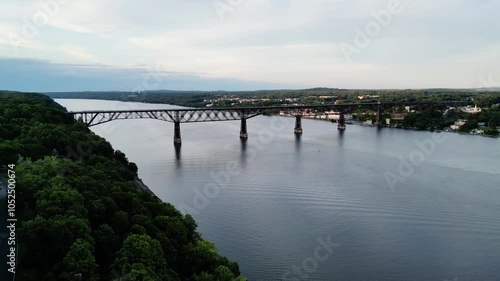 aerial footage of walkway over the hudson (railroad bridge converted to walking cycling pedestrian biking path part of empire state path and hudson valley rail trail) wide river crossing poughkeepsie