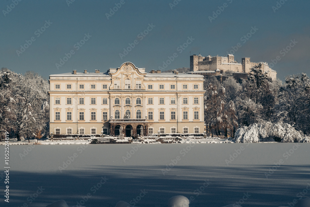 Schloss Leopoldskron palace with Hohensalzburg fortress in winter, Salzburg, Austria