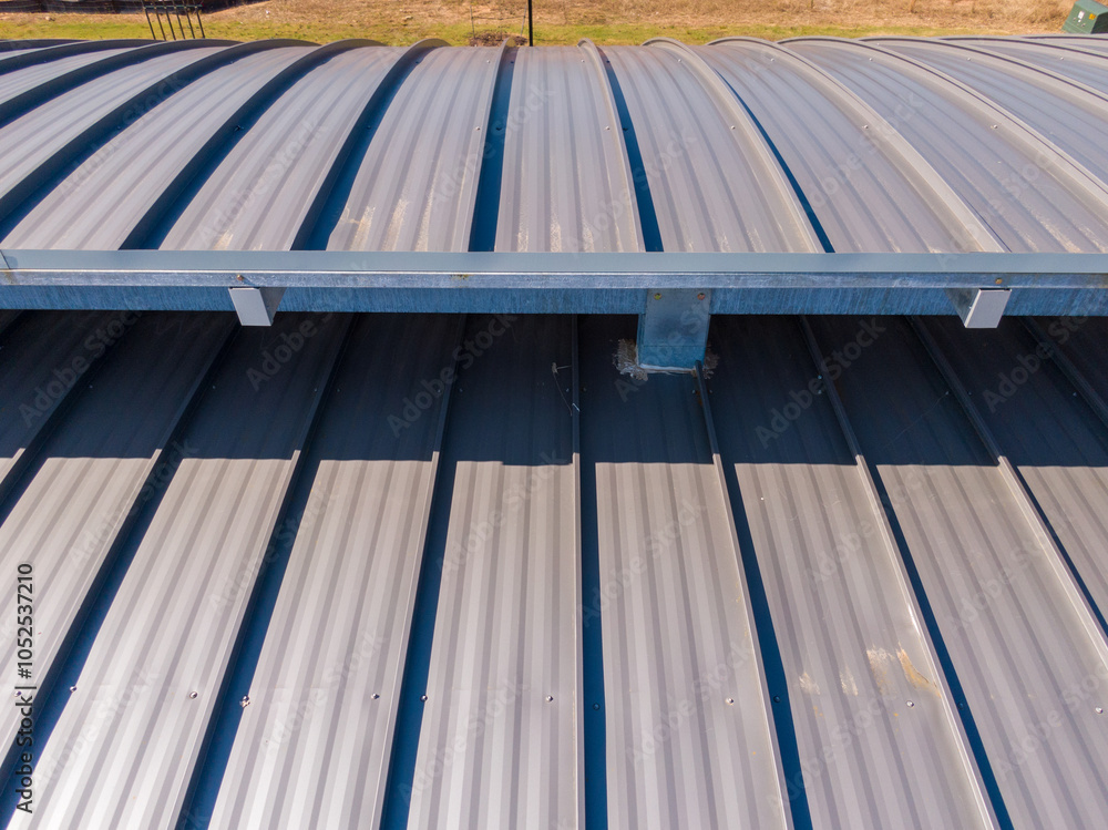 Obraz premium Sunny Daytime Drone Images of New Standing Seam Metal Roof on a Commercial Building