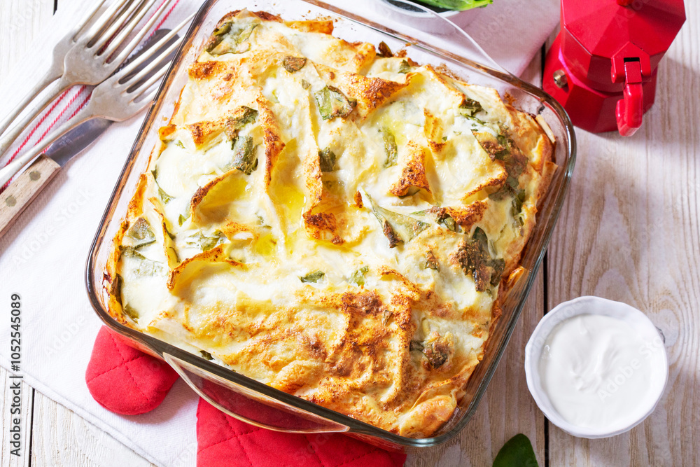 Traditional Bulgarian or Balkan pie banitsa made from filo dough, cream cheese and spinach.
