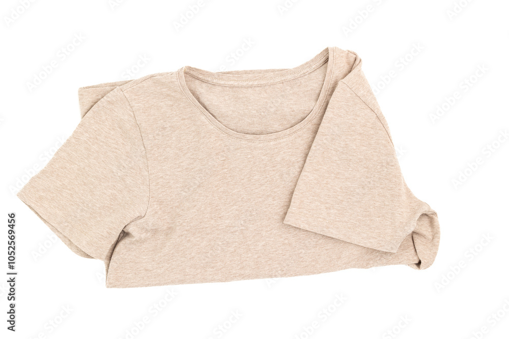 Beige cotton t-shirt folded in half on white background isolated Beige cotton t-shirt folded in half on white background isolated