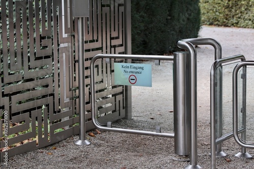 Modern Stainless Steel Gate with 'No Entrance' Sign – Bilingual Warning in German and English