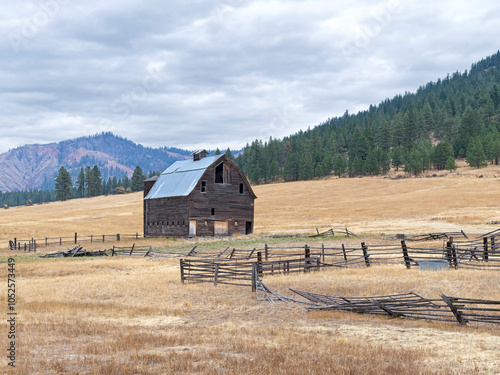 Old barn under a cloudy sky. photo