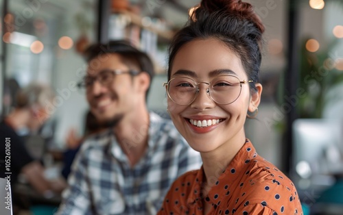 Wallpaper Mural Two cheerful colleagues smiling while discussing something Torontodigital.ca
