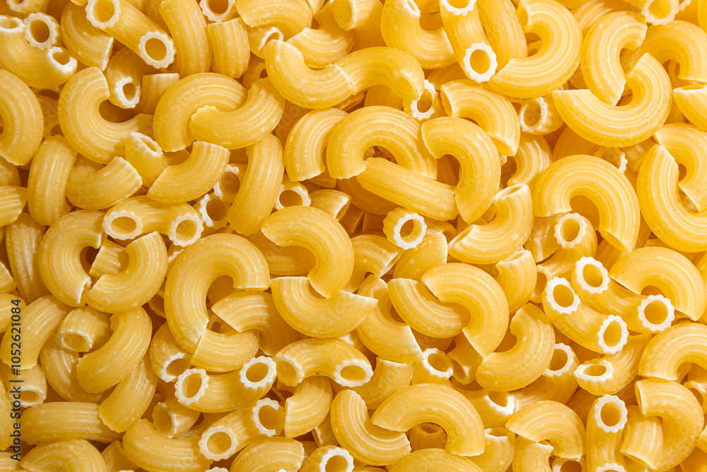 Uncooked Chifferi Rigati Pasta: A Culinary Canvas of Chifferi Rigati, Creating a Lively and Textured Background for Gourmet Cooking. Dry Pasta. Raw Macaroni - Top View, Flat Lay Uncooked Chifferi Rigati Pasta: A Culinary Canvas of Chifferi Rigati, Creating a Lively and Textured Background for Gourmet Cooking. Dry Pasta. Raw Macaroni - Top View, Flat Lay