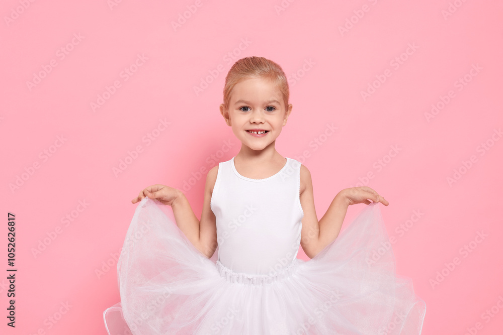 Little girl pretending to be ballerina on pink background. Dreaming of future profession Little girl pretending to be ballerina on pink background. Dreaming of future profession