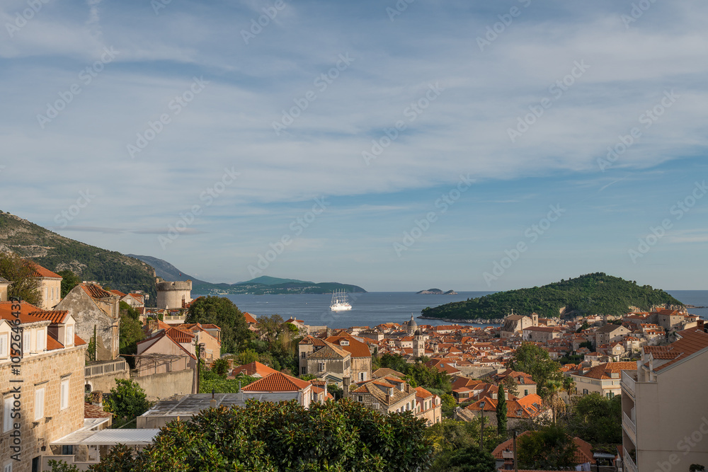 Dubrovnik old town with a Lokrum island. Blue sky and sea. Dubrovnik old town with a Lokrum island. Blue sky and sea.