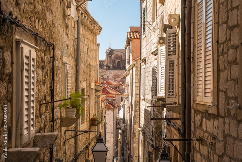 Fototapeta Naklejka Na Ścianę i Meble -  Narrow street in the old medieval town of mediterranean country