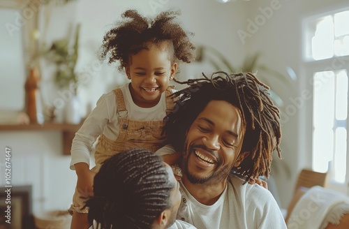 Happy Family Playing Together In Their Home