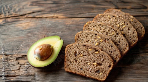 Sliced Rye Bread With Avocado and Spinach on Rustic Wooden Background