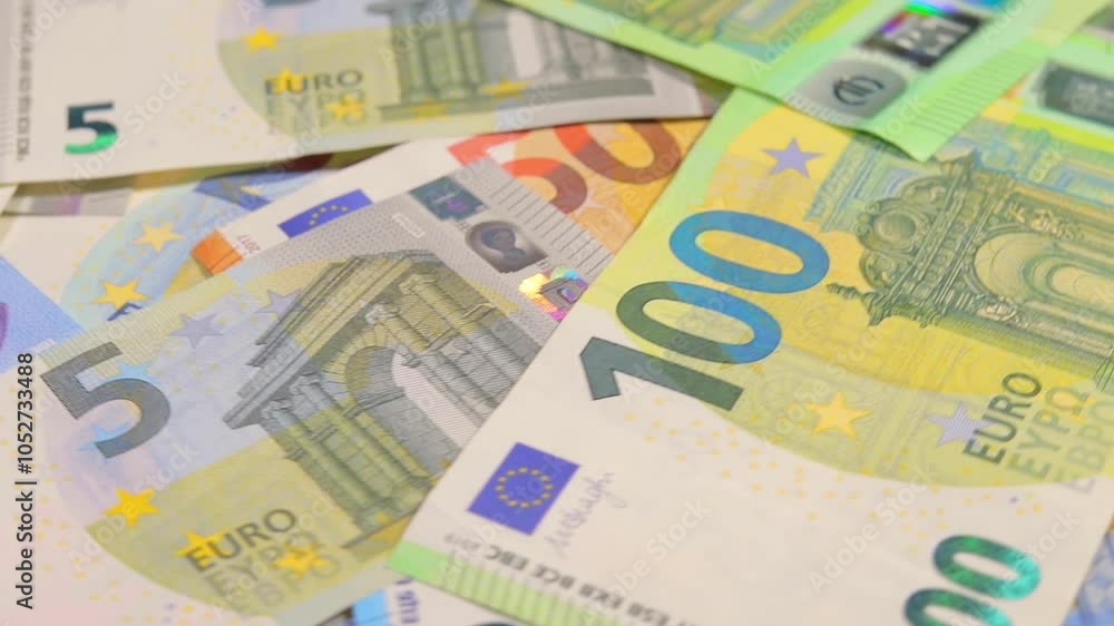 European Union Money: Different Euro Banknotes Rotating. Euro Currency. Colored Paper Money. A Lot of Euro Cash. Income, Earnings, Money Saving and Wealth Concept - Close-Up European Union Money: Different Euro Banknotes Rotating. Euro Currency. Colored Paper Money. A Lot of Euro Cash. Income, Earnings, Money Saving and Wealth Concept - Close-Up