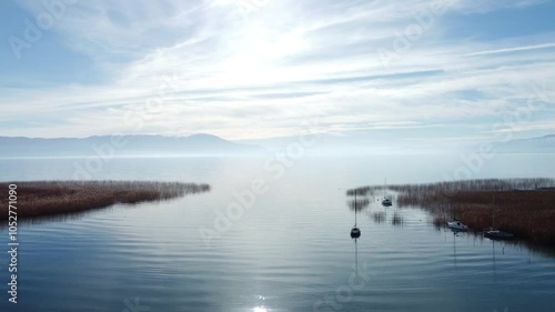 Drone Ascends Over Pristine Lake Reflections