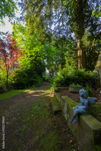 Little Grave Figurine on a Cemetery photo