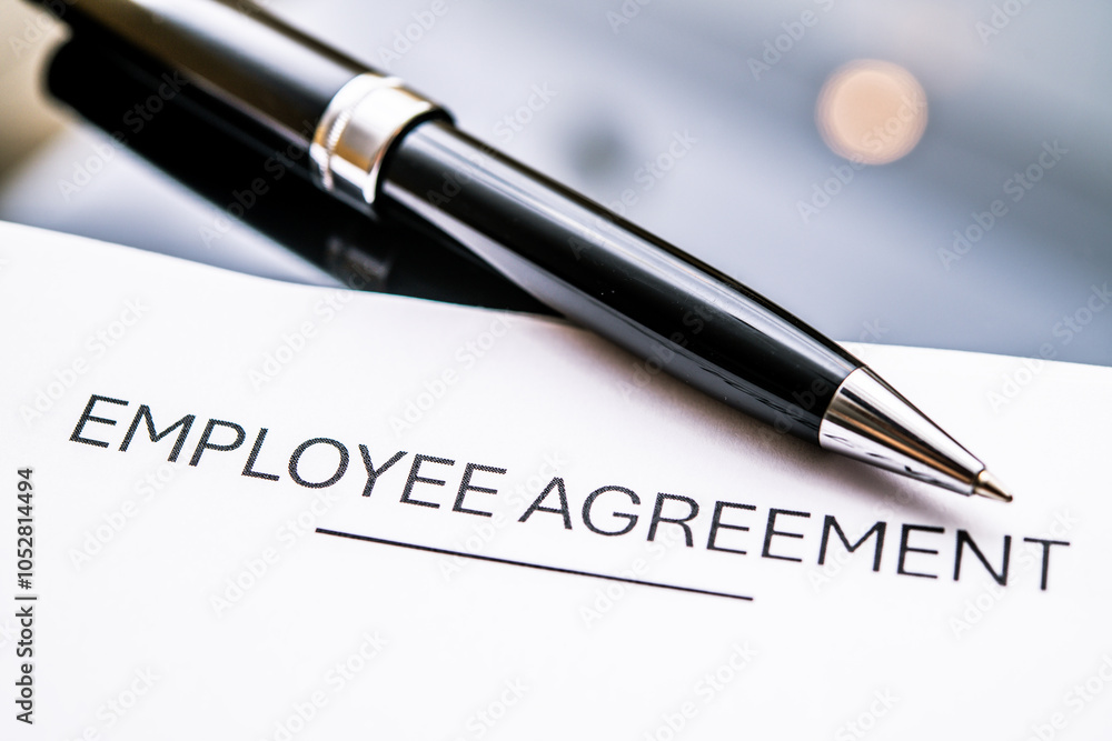 Close-Up of an Employee Agreement Document with a Pen, Representing Workplace Contracts, HR Policies, and Legal Obligations in Professional Settings Close-Up of an Employee Agreement Document with a Pen, Representing Workplace Contracts, HR Policies, and Legal Obligations in Professional Settings