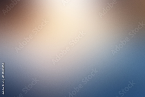 A blurry blue and brown background with a yellowish light. Noisy backdrop with grain