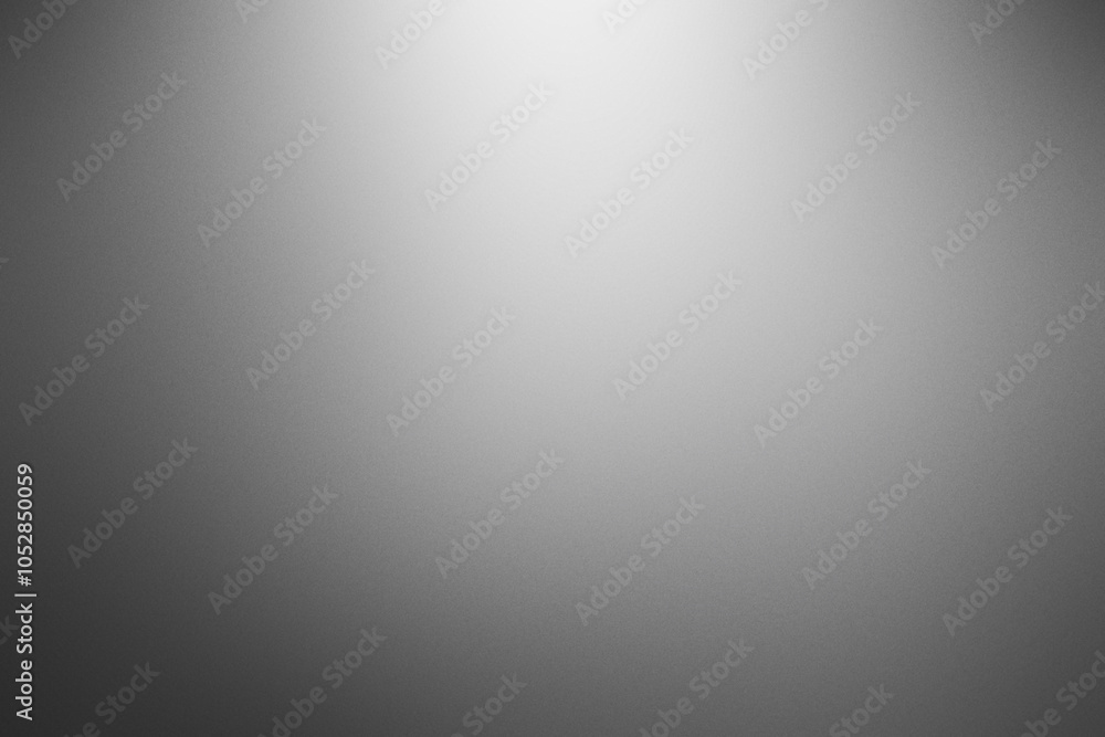 A grey background with a white light shining on it. Noisy backdrop with grain A grey background with a white light shining on it. Noisy backdrop with grain