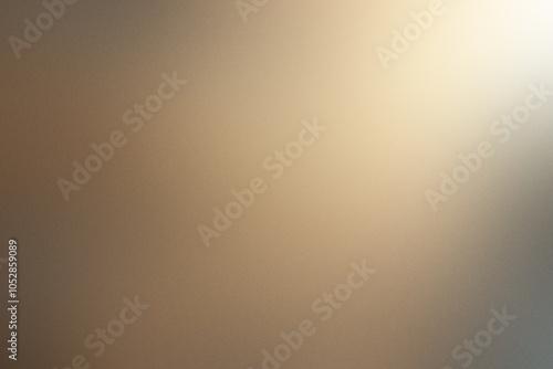 A blurry image of a brown background with a light shining on it. Noisy backdrop with grain