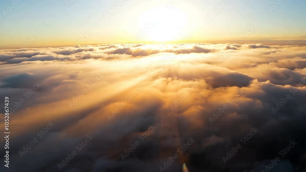 Golden Hour Above the Clouds: A breathtaking aerial view of a sun-drenched sky, with golden rays piercing through fluffy clouds, creating an ethereal and inspiring scene. Golden Hour Above the Clouds: A breathtaking aerial view of a sun-drenched sky, with golden rays piercing through fluffy clouds, creating an ethereal and inspiring scene.