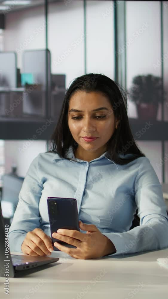 Vertical video Indian employee engages in an online meeting with her team, discussing project briefs and upcoming deadlines. Using video call to ensure seamless communication and time management Vertical video Indian employee engages in an online meeting with her team, discussing project briefs and upcoming deadlines. Using video call to ensure seamless communication and time management